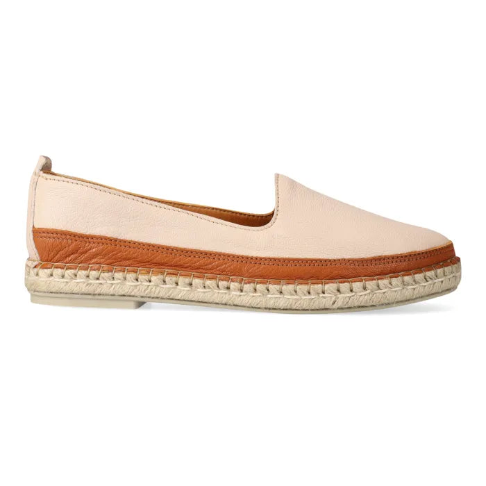 Pink espadrille shoe with brown trim on a white background