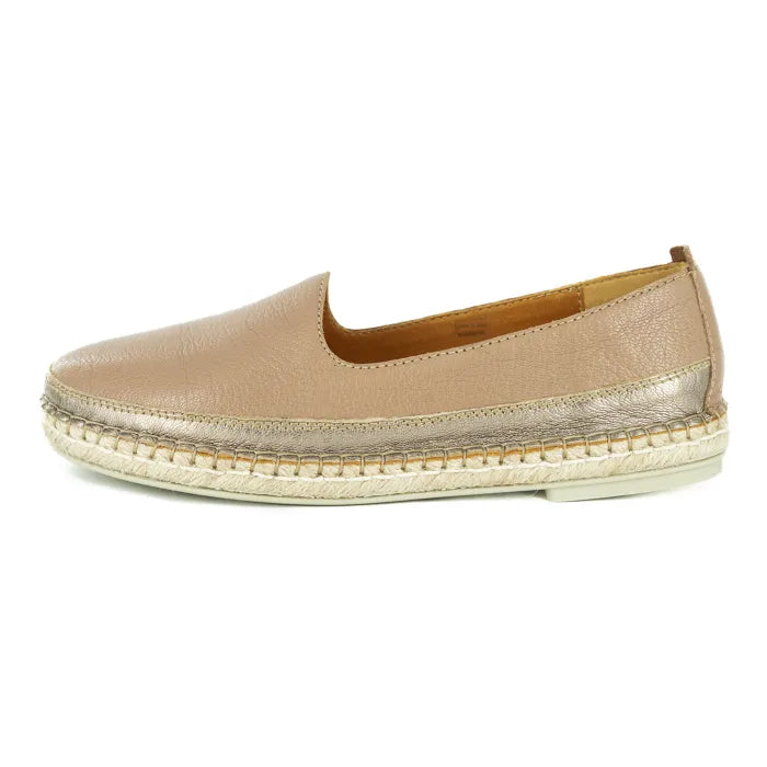 Beige slip-on shoe with a textured sole on a white background