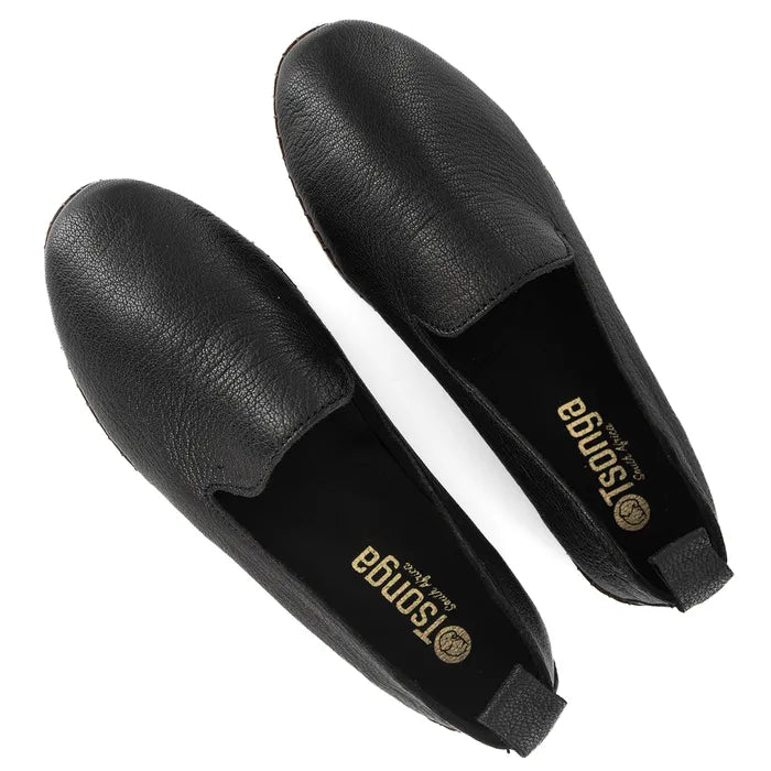 Pair of black leather shoes with 'Tsonga' branding on a white background