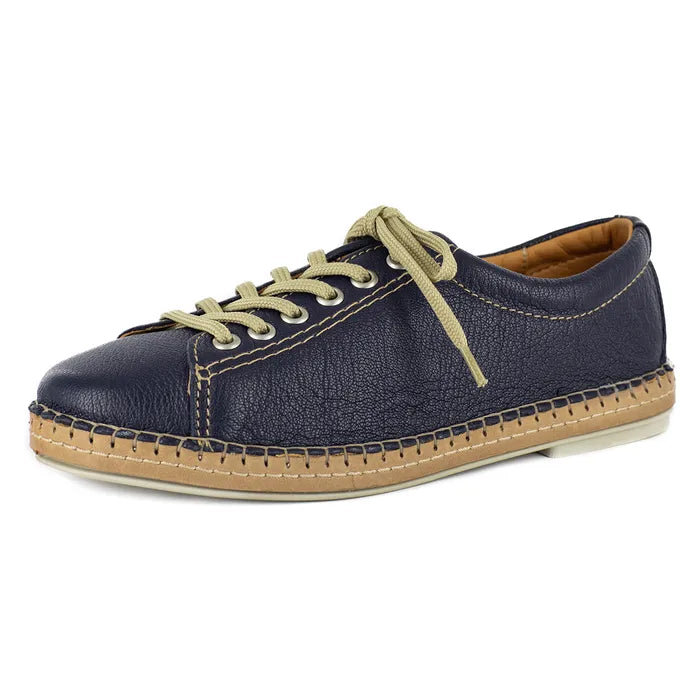 Navy blue casual shoe with beige sole on a white background