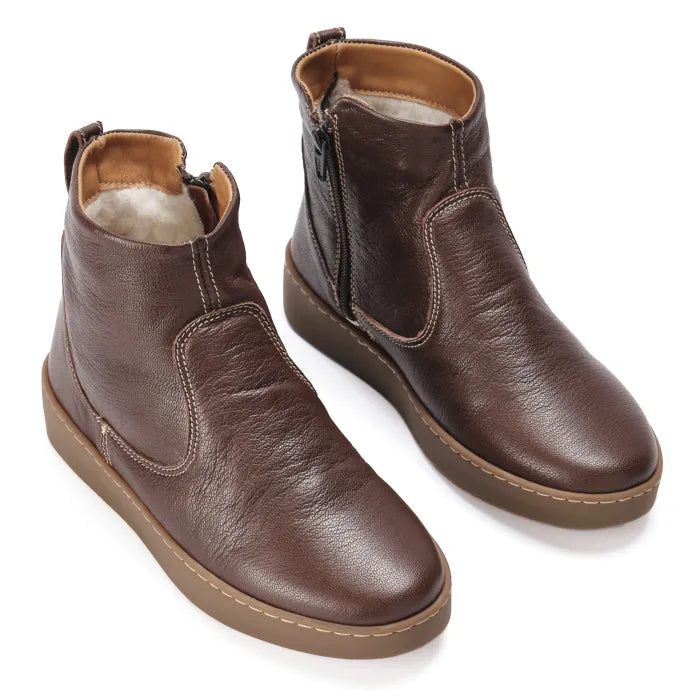 Pair of brown leather boots on a white background