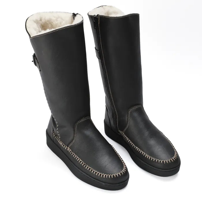 Pair of black leather boots with white wool lining on a white background