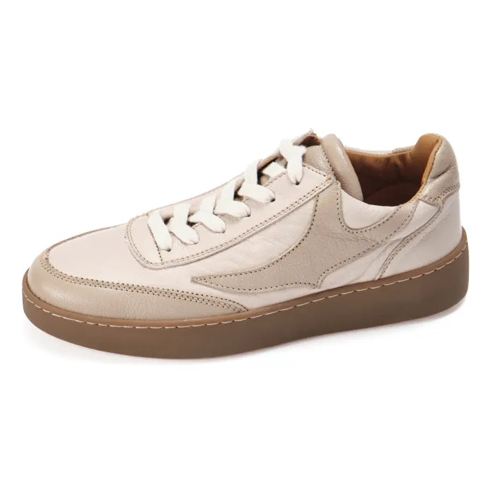 Beige sneaker with brown sole on a white background