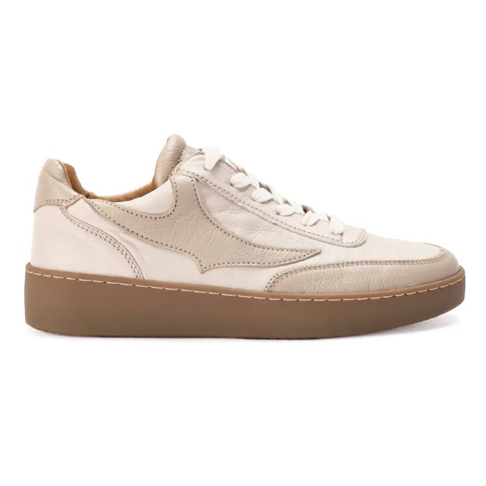 Beige sneaker with brown sole on a white background