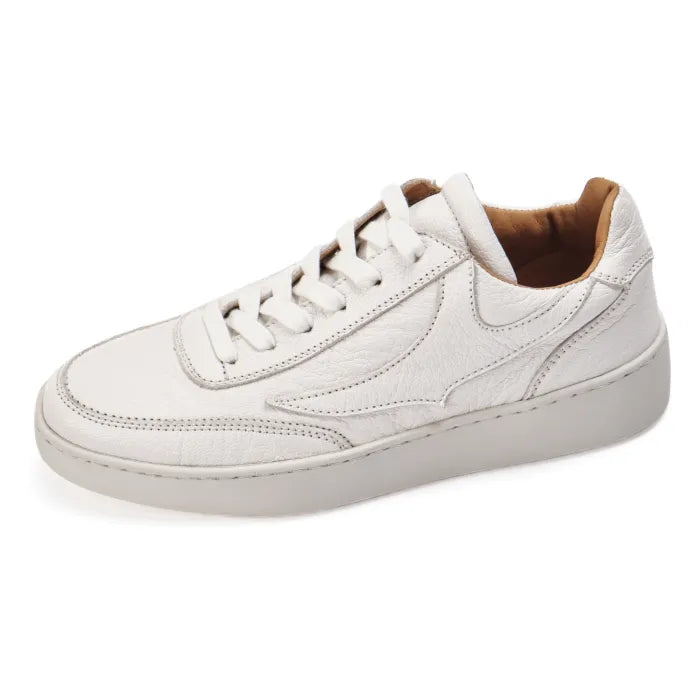 White sneaker with brown lining on a white background