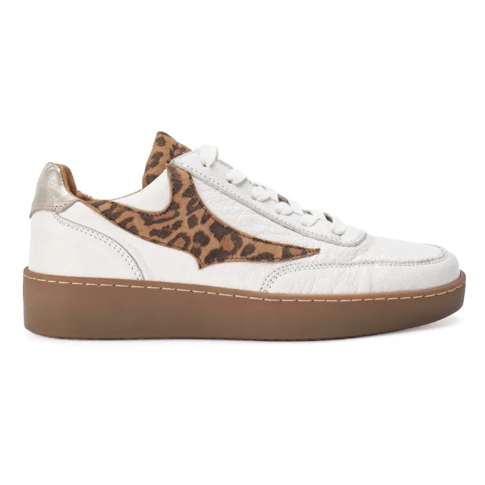 White sneaker with leopard print accents on a white background