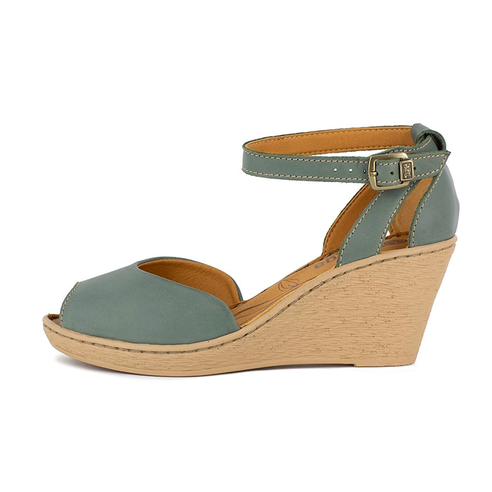 Green wedge sandal with beige sole on a white background