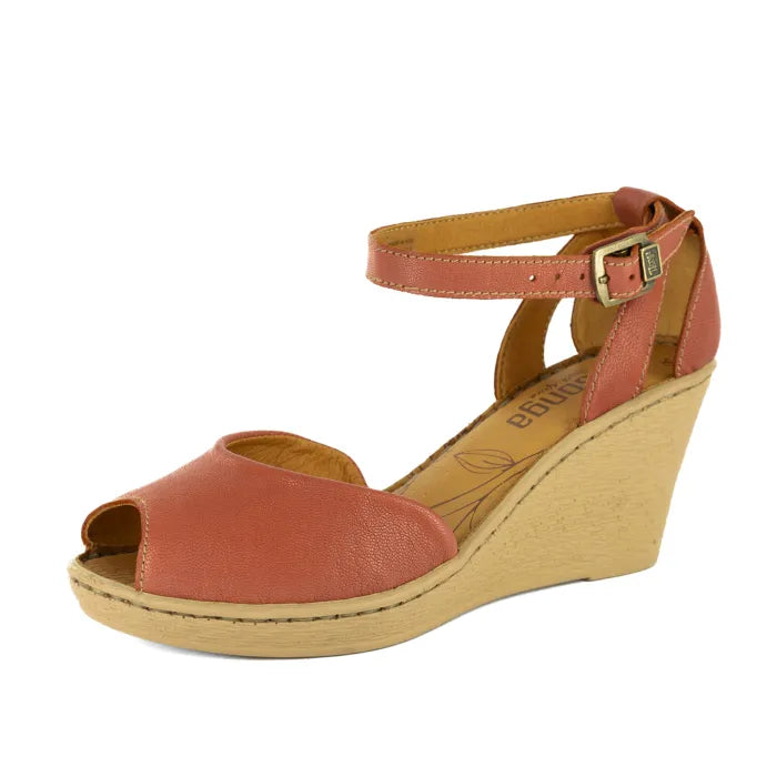 Wedge sandal with open toe and tan wedge on a white background