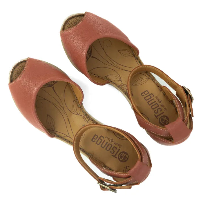 Pair of pink sandals with 'Tsonga' branding on a white background