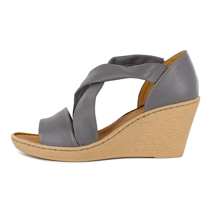 Grey wedge sandal with a beige sole on a white background