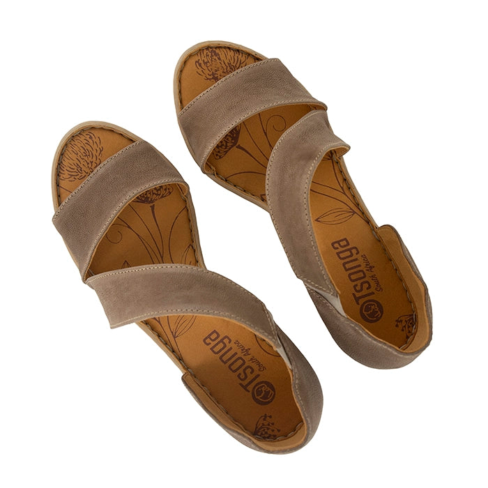 Pair of beige sandals with 'Tsonga' branding on a white background