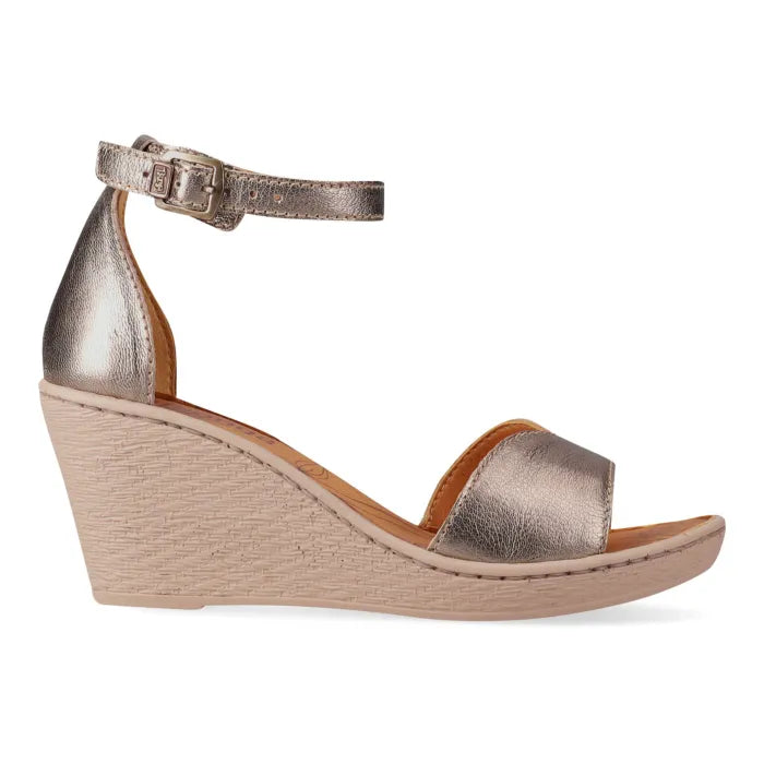 Gold wedge sandal on a white background