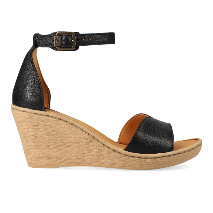 A single black leather wedge sandal with ankle straps and open toes, featuring a tan insole and a light brown wedge heel, shown on a white background.