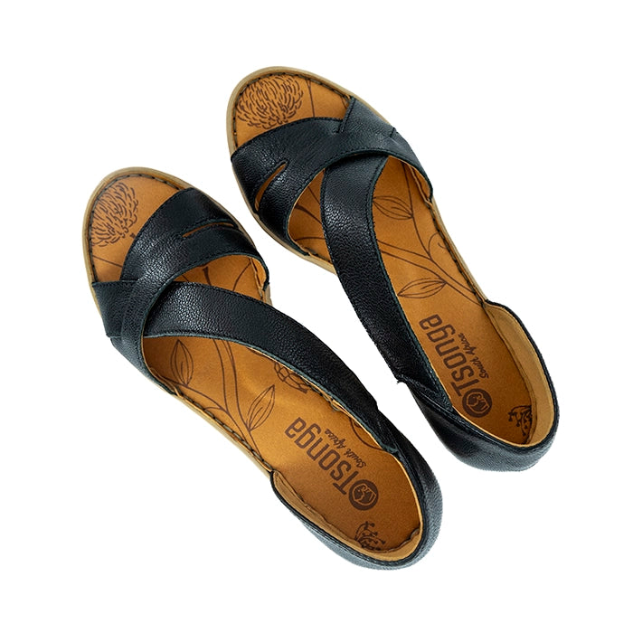 Black wedge sandal with a tan sole on a white background