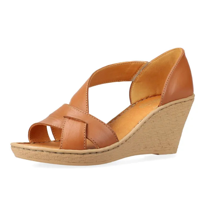 A tan leather wedge sandal with crisscrossing straps and a wedge heel, shown from a side profile on a white background.