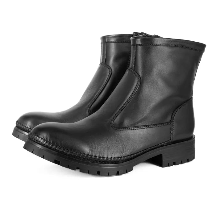 Pair of black leather boots on a white background