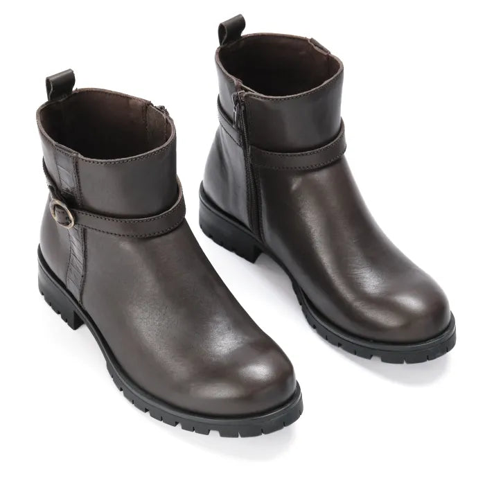 Pair of brown leather boots on a white background