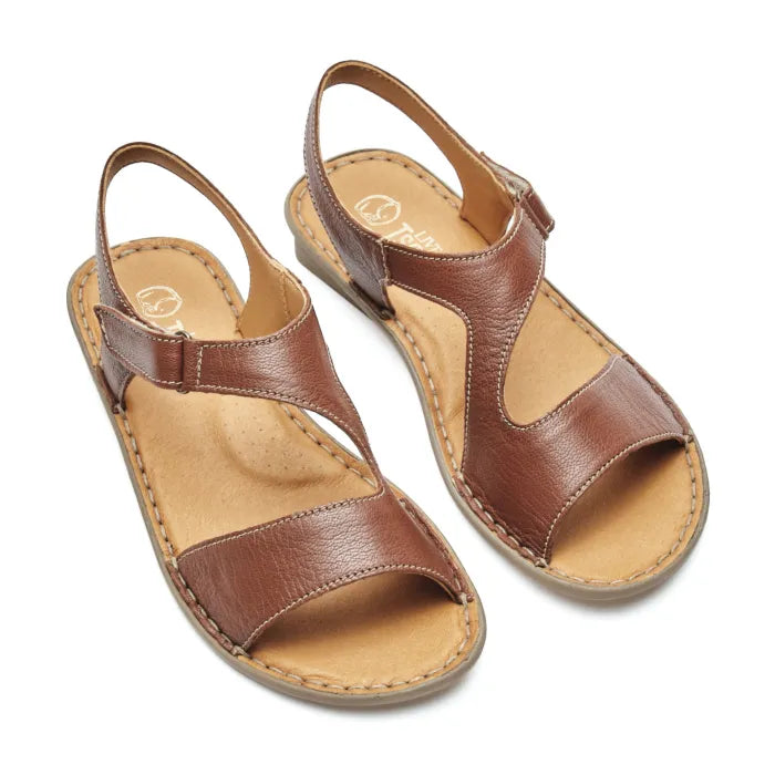 A pair of women's brown leather slide sandals with adjustable straps and a tan footbed, shown on a plain white background.