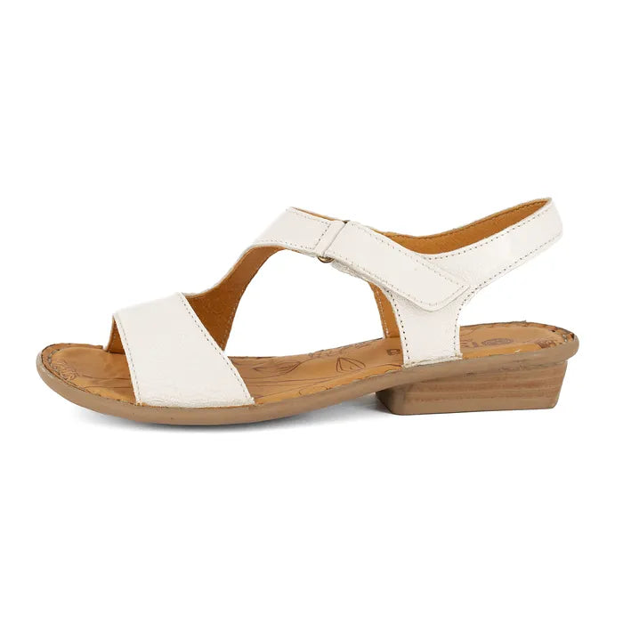 Women’s white leather slingback sandals with low heel.