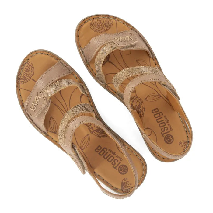 Pair of tan sandals with floral patterns on a white background