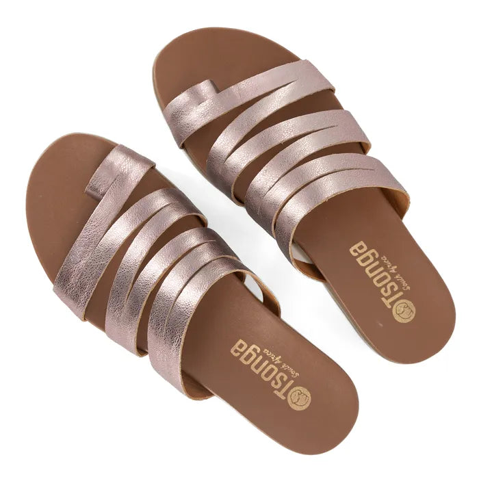 Pair of pink sandals with multiple straps on a white background