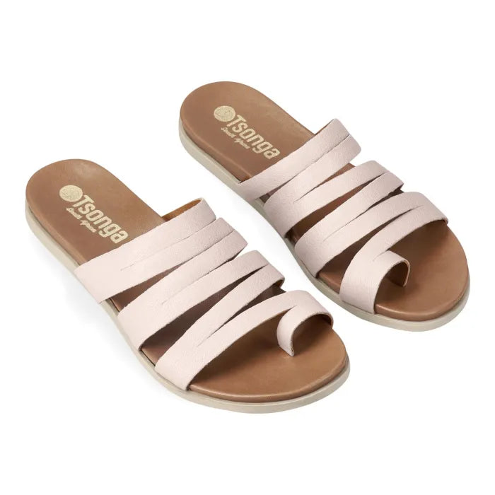 Pair of cream sandals with off white soles on a white background