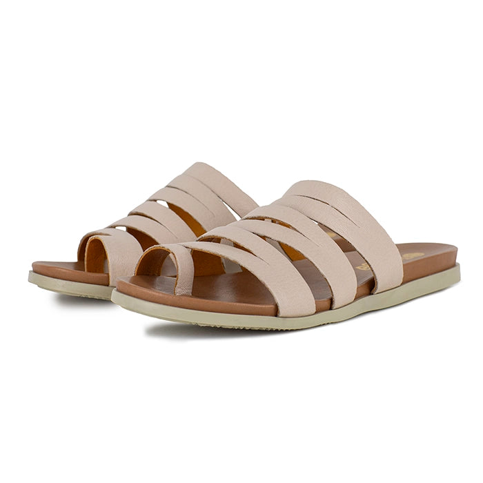 Pair of beige sandals with brown soles on a white background