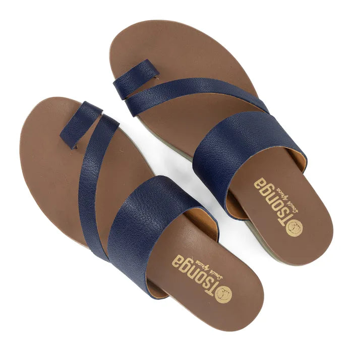 Pair of brown sandals with navy straps on a white background