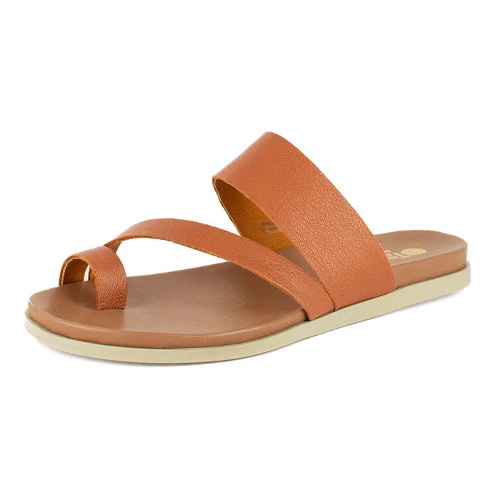 Brown sandal with a off-white sole on a light beige background