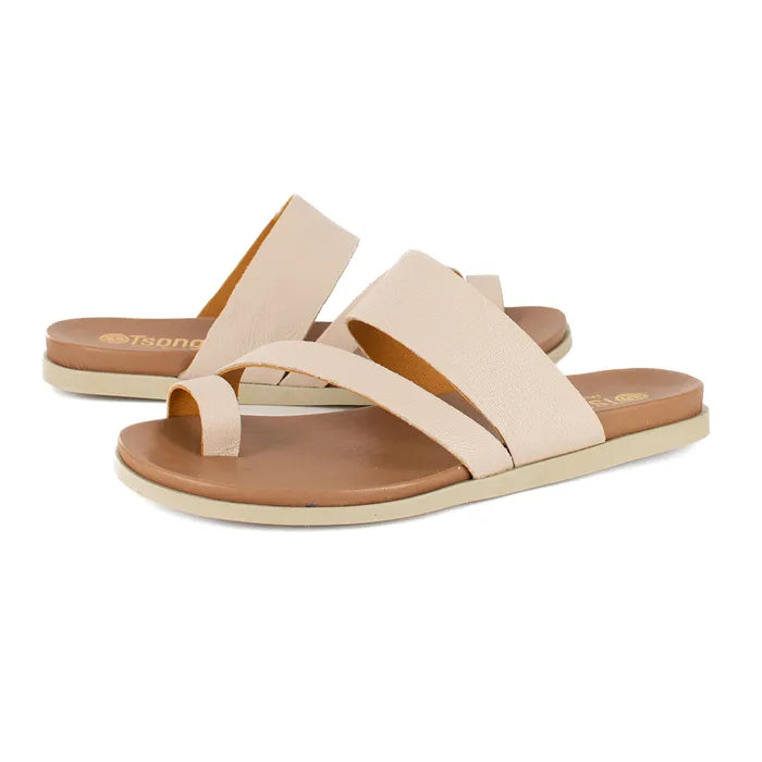 Beige sandals with brown soles on a white background