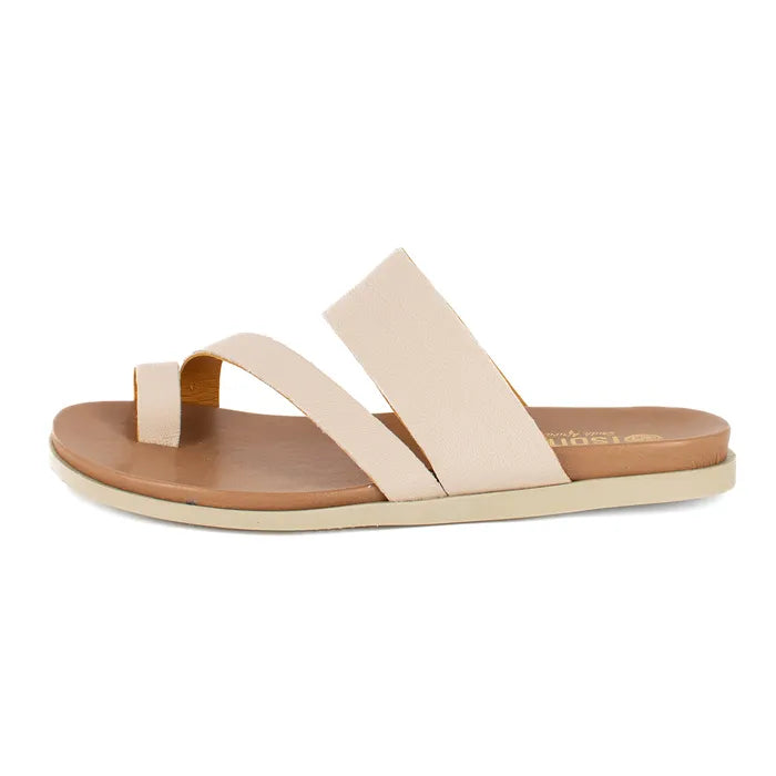 Beige sandal with a brown sole on a white background