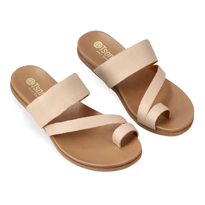 Pair of beige sandals with a visible brand logo on a white background