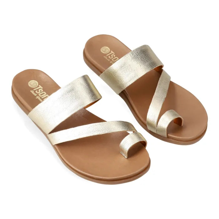 Pair of gold sandals on a white background