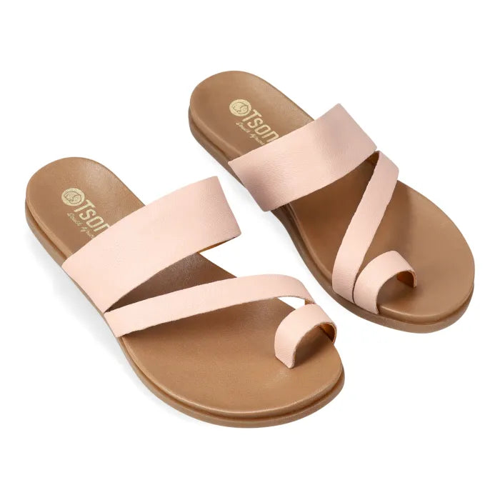 Pair of light pink sandals on a white background