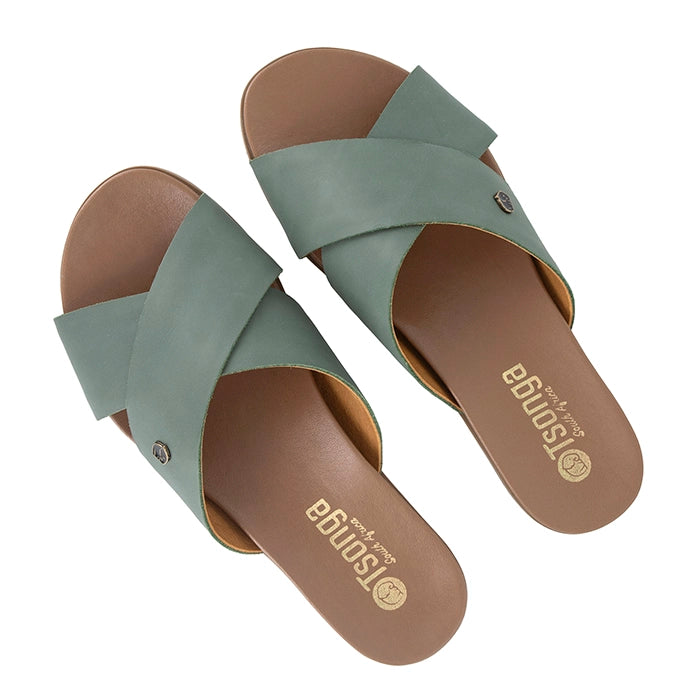 Pair of green sandals with tan soles on a white background