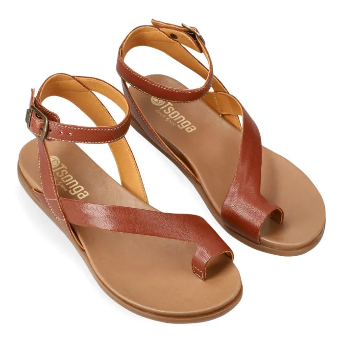 Pair of brown sandals with ankle strap on a white background