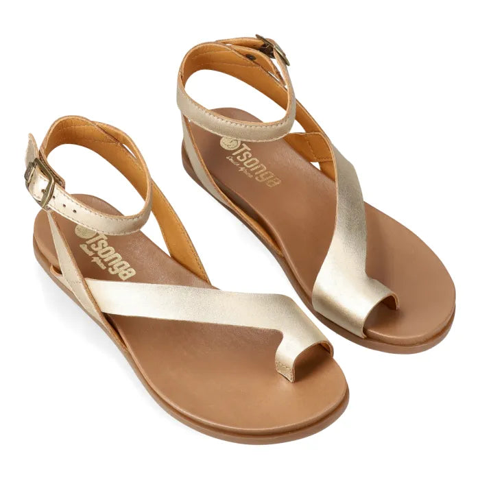 Pair of gold sandals with ankle strap on a white background