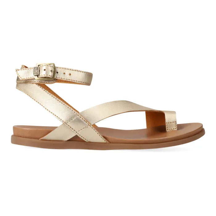 Pair of gold sandals with ankle strap on a white background