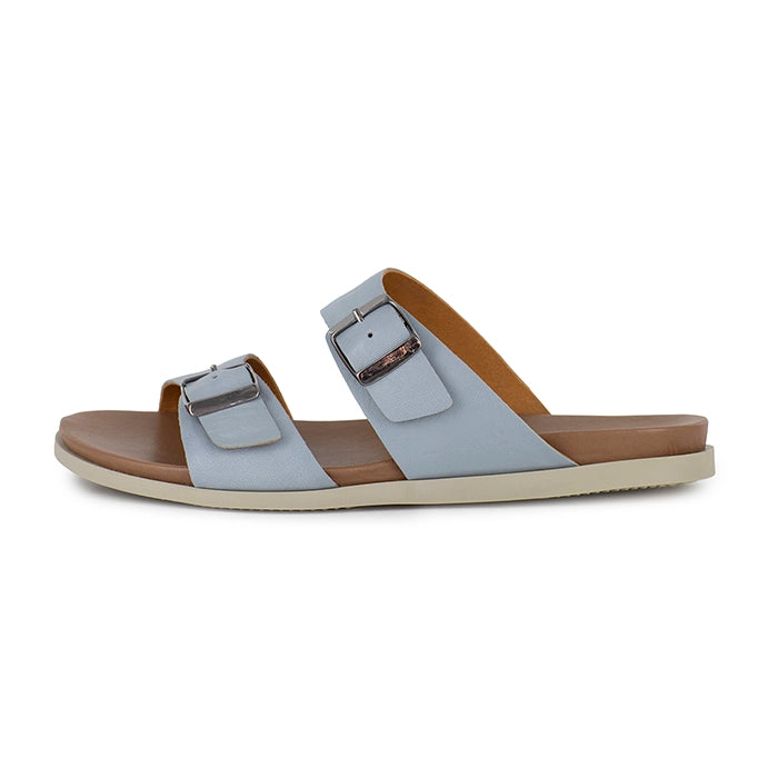 Sandal with light blue straps and tan insole on a white background