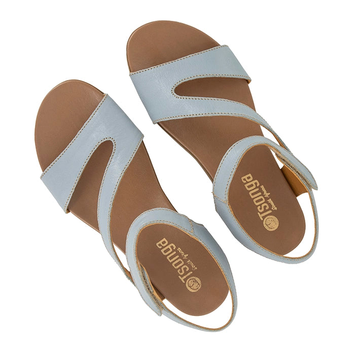 Pair of light blue sandals with brown soles on a white background