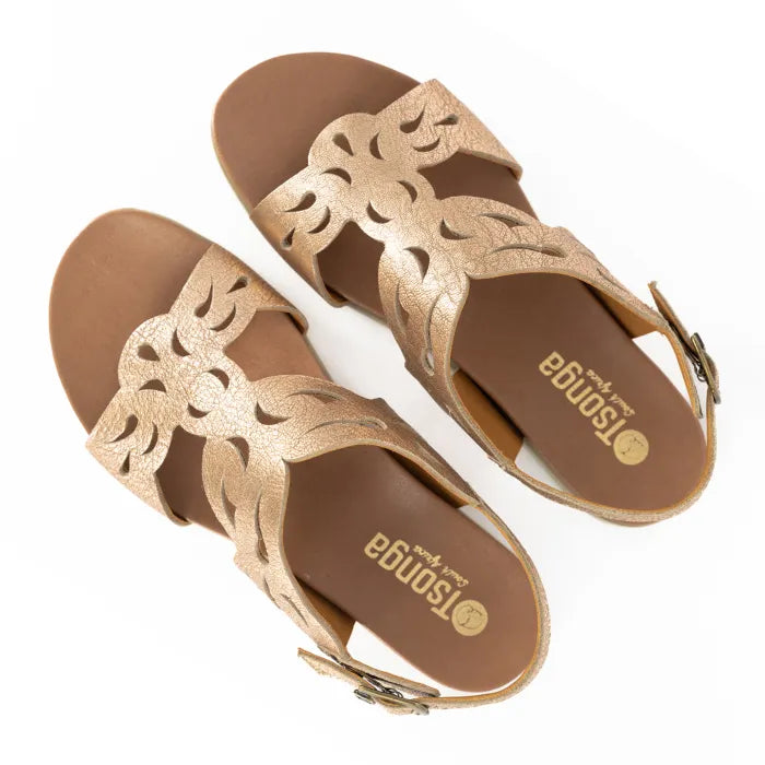 Pair of gold sandals with cut-out design on a white background