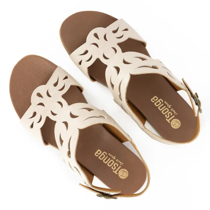 Pair of beige sandals with brown soles on a white background