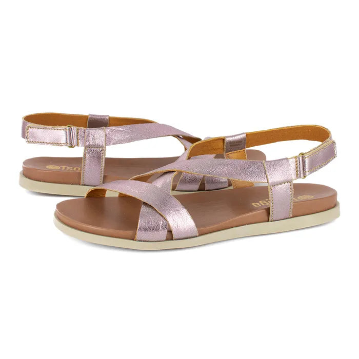 Pair of rose gold sandals on a white background