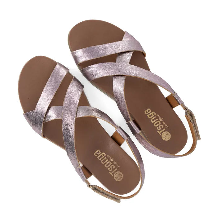 Pair of pink strappy sandals on a white background