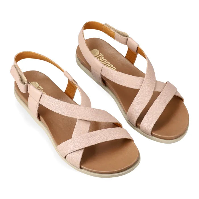 Pink sandals with multiple straps on a white background