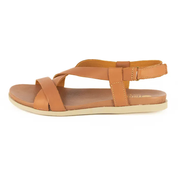 Tan sandal with criss-cross straps on a white background