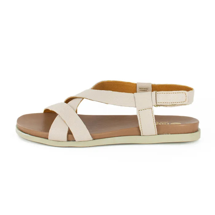 Beige sandal with brown sole on a white background