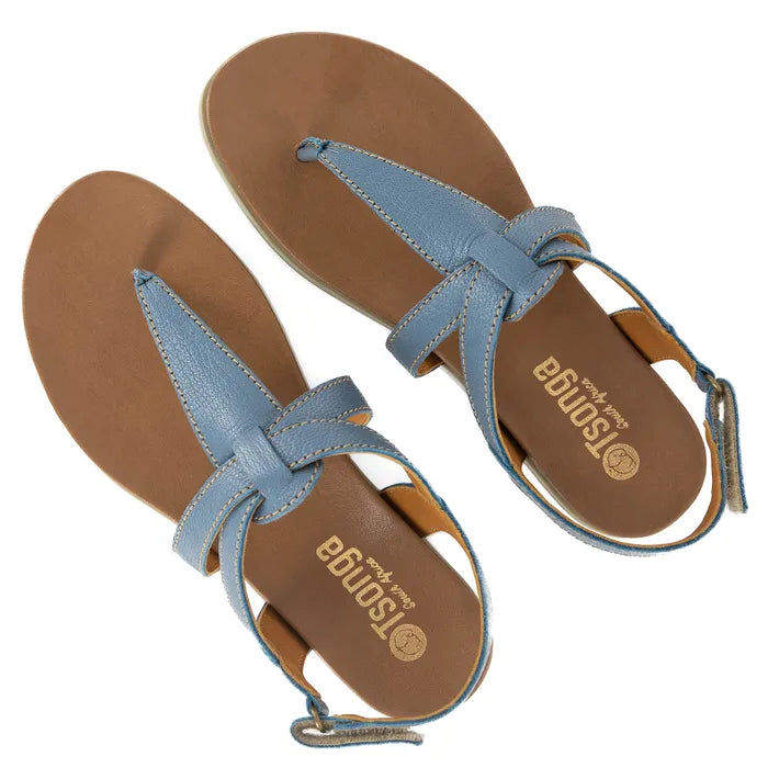 Pair of blue sandals with off white soles on a white background