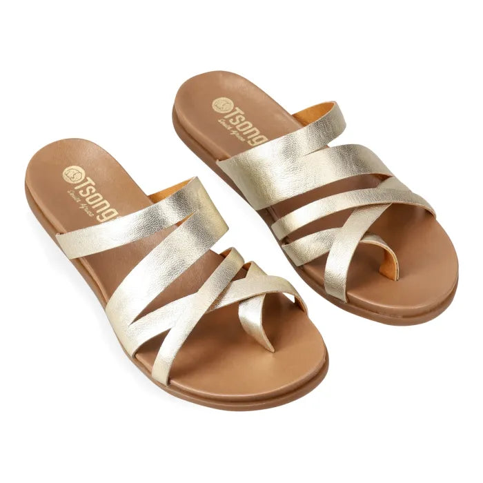 Gold sandals with multiple straps on a white background