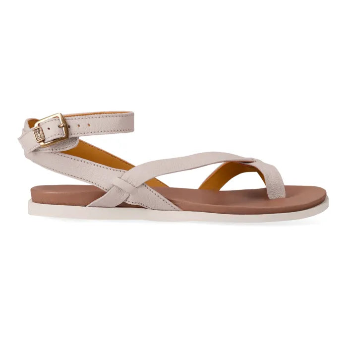 Cream sandal with a tan sole on a white background